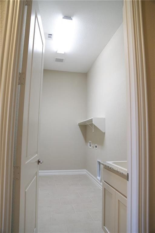 washroom with electric dryer hookup and hookup for a washing machine