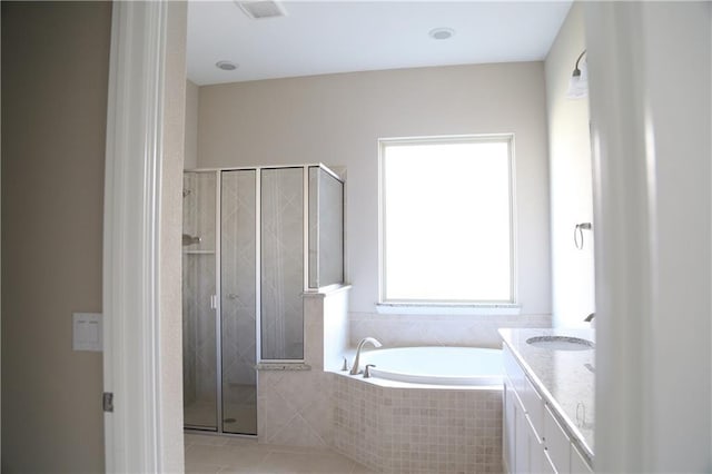 bathroom with vanity, tile patterned flooring, and shower with separate bathtub