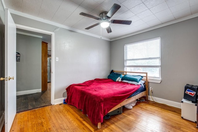 bedroom featuring ceiling fan and wood-type flooring