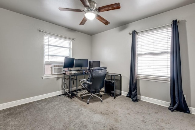 office space with cooling unit, ceiling fan, and carpet