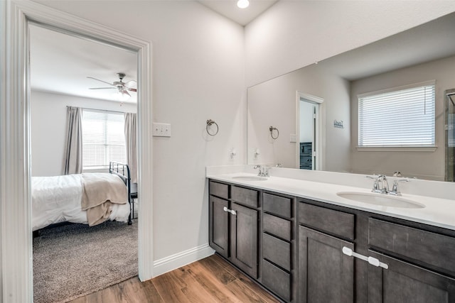 bathroom with vanity, ceiling fan, and wood-type flooring