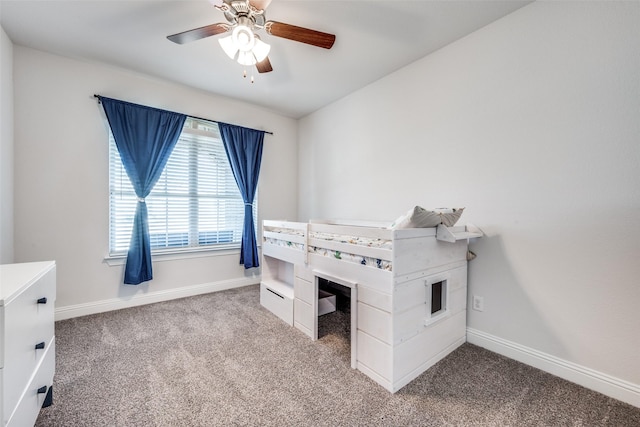 unfurnished bedroom featuring carpet flooring and ceiling fan