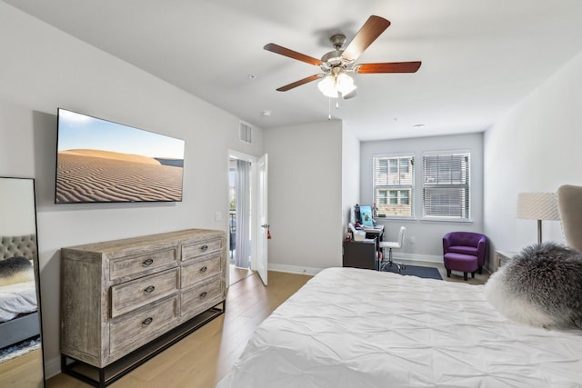 bedroom featuring light wood-type flooring and ceiling fan