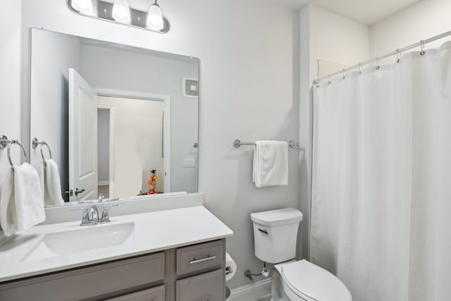 bathroom with toilet and vanity