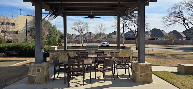 view of patio featuring an outdoor bar and area for grilling