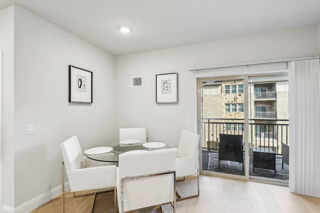 dining space featuring hardwood / wood-style flooring