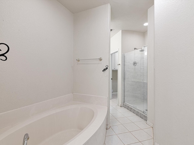 bathroom with separate shower and tub, toilet, and tile patterned floors