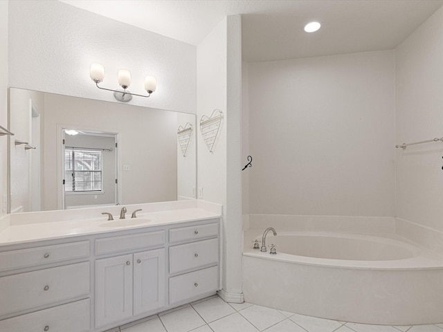 bathroom with vanity, a bathtub, and tile patterned floors