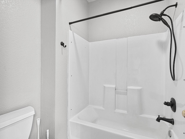 bathroom featuring toilet and bathtub / shower combination