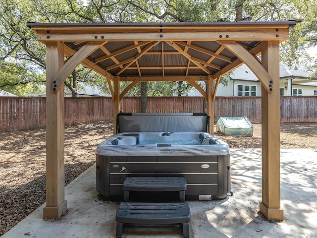 view of patio / terrace with a gazebo and a hot tub