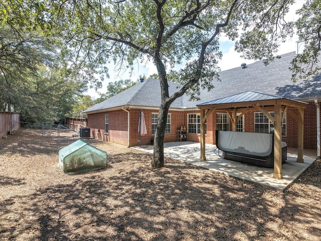 back of property featuring a patio and central AC unit