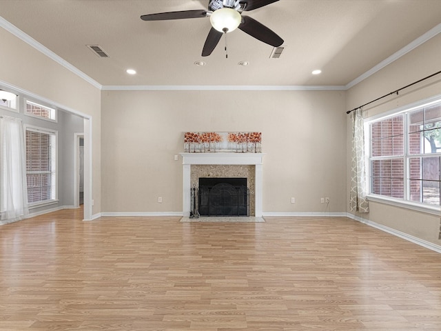 unfurnished living room with ceiling fan, light hardwood / wood-style floors, and ornamental molding