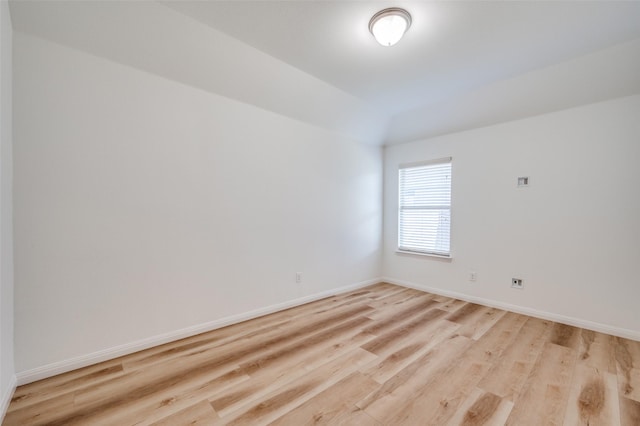 spare room with light hardwood / wood-style flooring