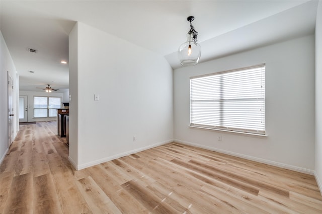 empty room featuring ceiling fan and light wood-type flooring