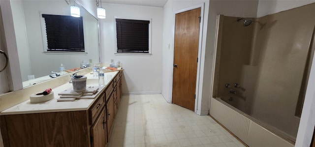 bathroom with vanity and  shower combination