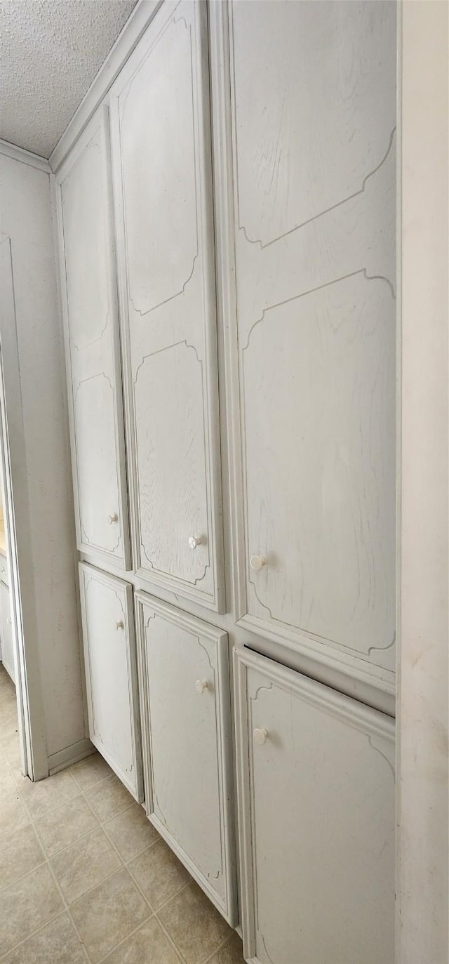 interior details featuring a textured ceiling