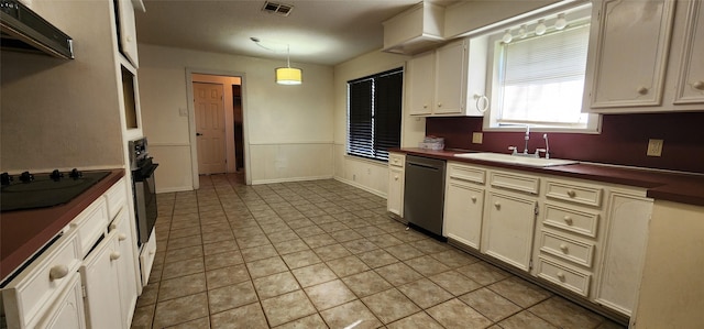 kitchen featuring pendant lighting, sink, black appliances, light tile patterned flooring, and exhaust hood