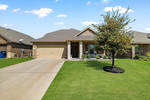 view of front facade with covered porch, a front yard, and a garage