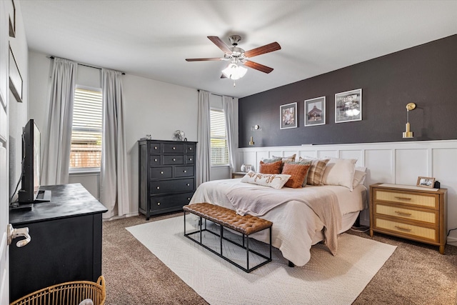 bedroom with dark colored carpet and ceiling fan