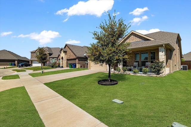 view of front facade featuring a porch, central air condition unit, and a front lawn