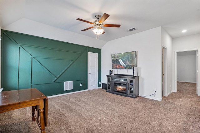 interior space with lofted ceiling and ceiling fan