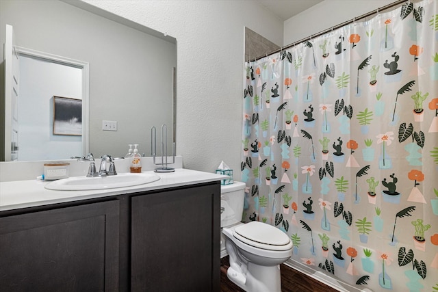 full bathroom with shower / bathtub combination with curtain, vanity, toilet, and hardwood / wood-style floors