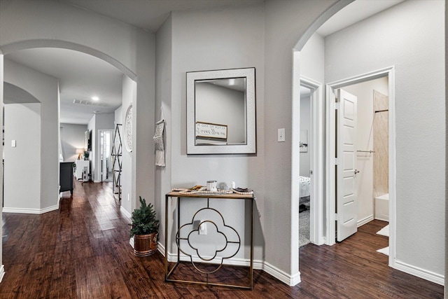 hall with dark wood-type flooring