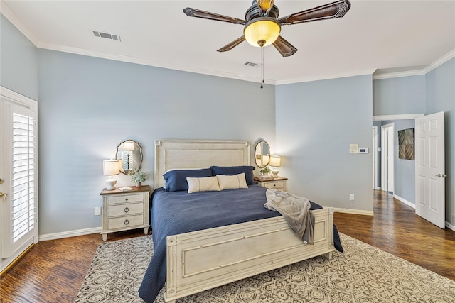 bedroom featuring dark hardwood / wood-style flooring, multiple windows, and ornamental molding