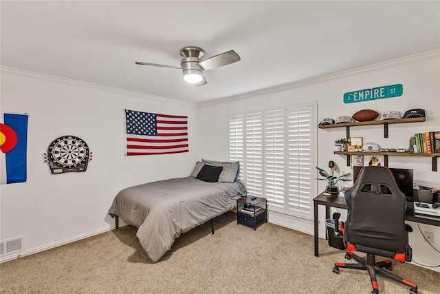 bedroom with crown molding, light colored carpet, and ceiling fan