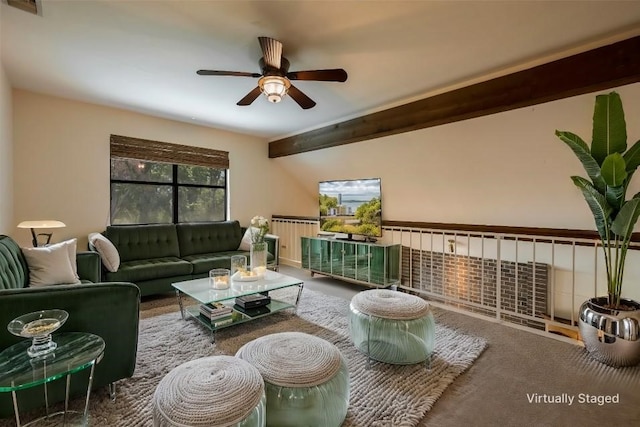 living room with vaulted ceiling with beams