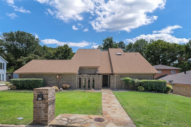 view of front of home with a front yard