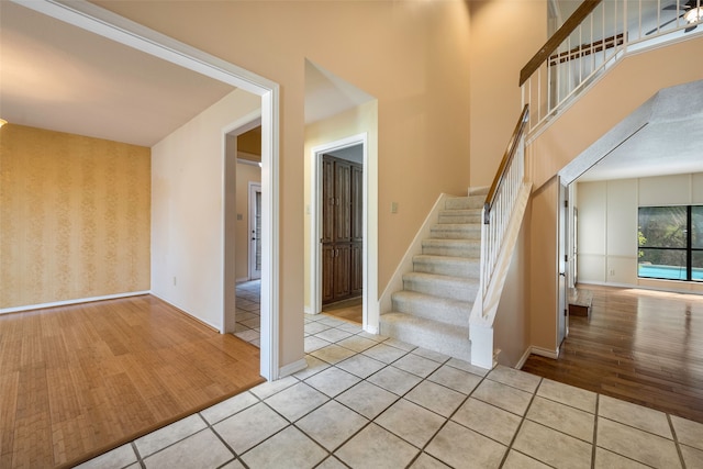 stairway with tile patterned floors