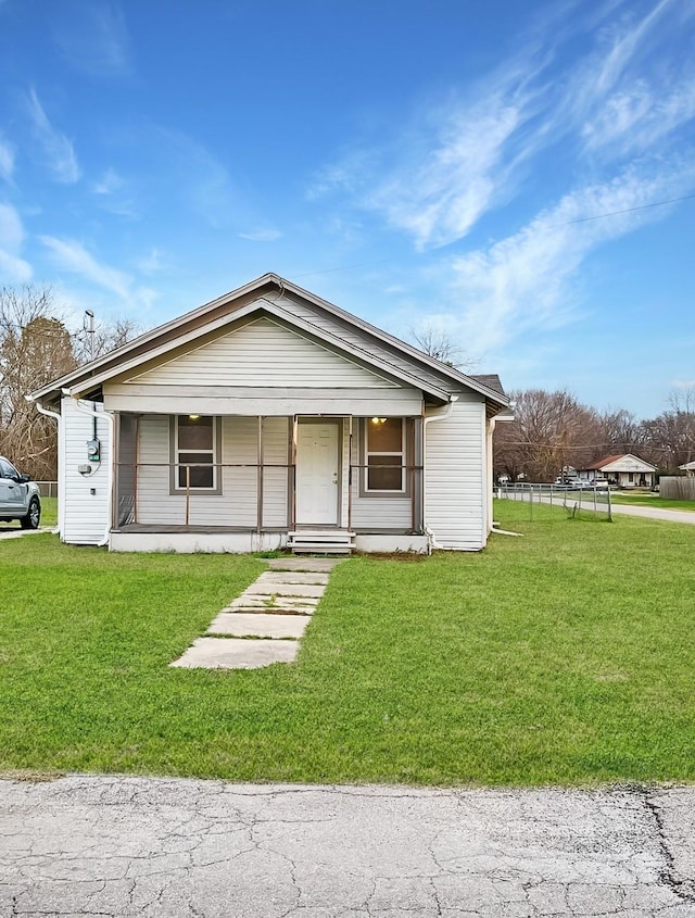 view of front of house with a front lawn and covered porch