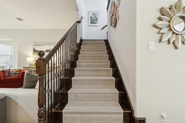 staircase featuring hardwood / wood-style floors