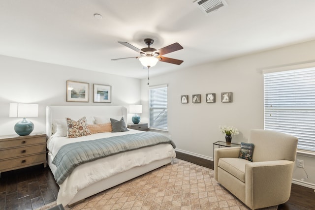 bedroom with hardwood / wood-style flooring and ceiling fan