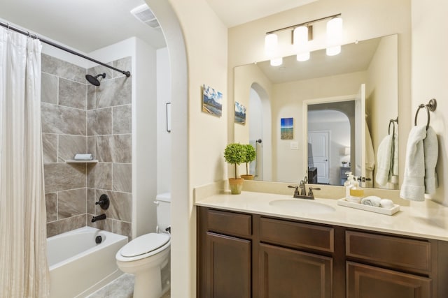 full bathroom featuring vanity, toilet, and shower / bath combo with shower curtain