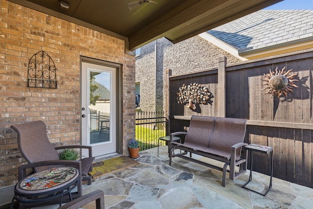 view of patio / terrace featuring ceiling fan