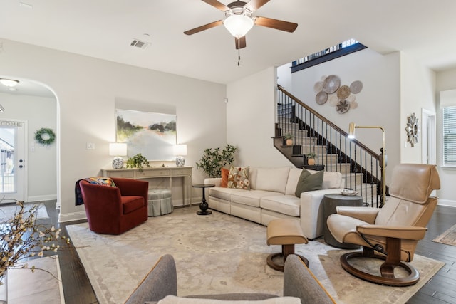 living room featuring ceiling fan and hardwood / wood-style floors