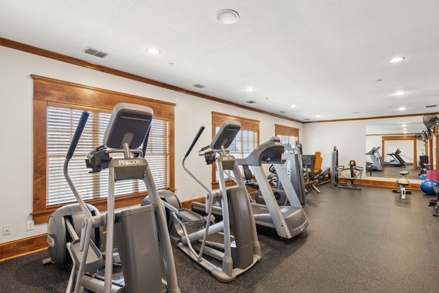 workout area with crown molding