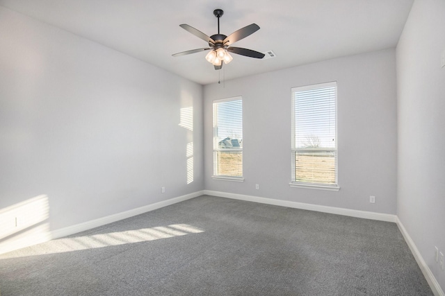 empty room featuring ceiling fan and carpet floors