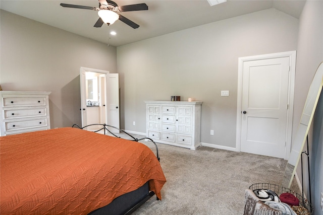 bedroom with vaulted ceiling, light colored carpet, and ceiling fan