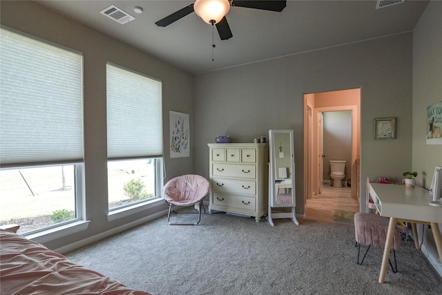 carpeted bedroom featuring ceiling fan and connected bathroom