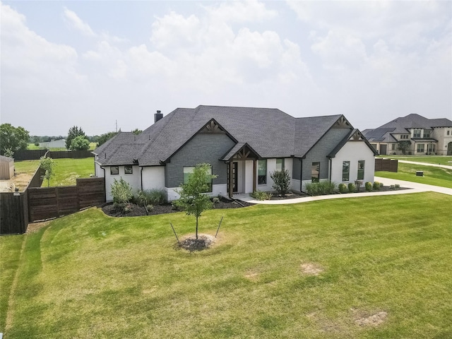 french country style house featuring a front lawn