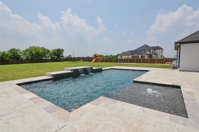 view of pool with a lawn, pool water feature, a playground, and a patio area