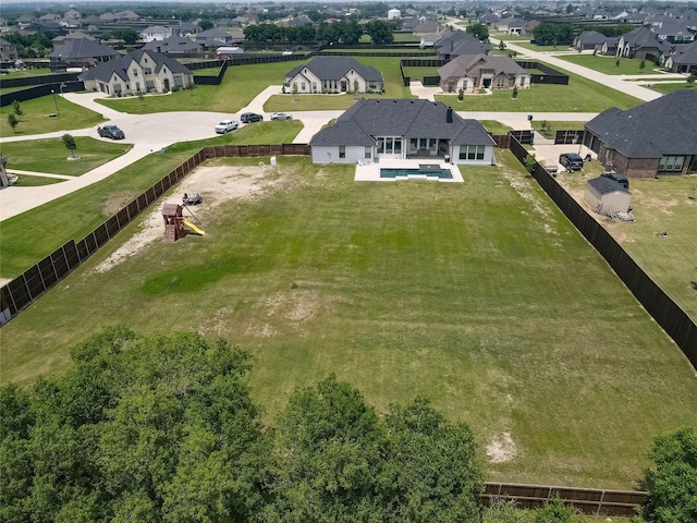 birds eye view of property with a residential view