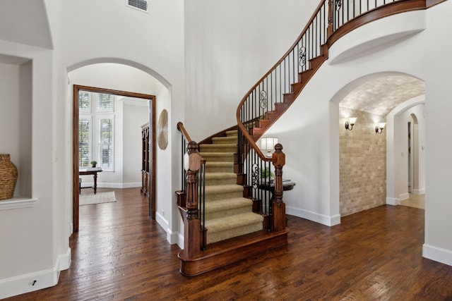 foyer entrance with dark hardwood / wood-style flooring