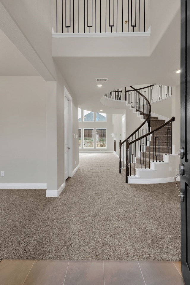 interior space with a towering ceiling