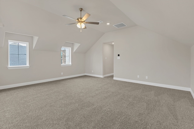 bonus room with ceiling fan, carpet, and vaulted ceiling