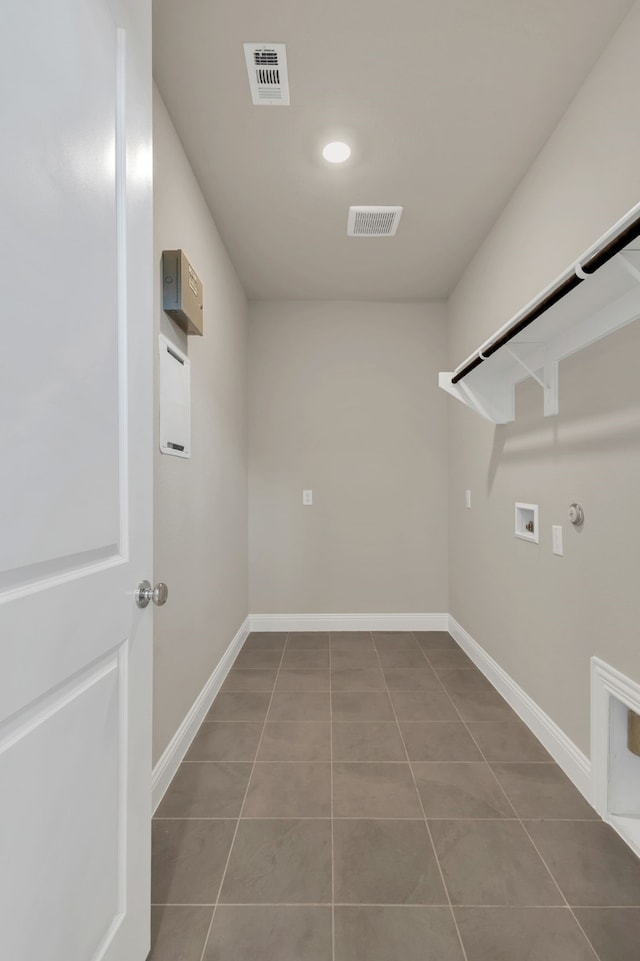 laundry room featuring washer hookup, tile patterned flooring, and hookup for a gas dryer