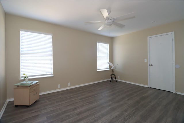 unfurnished room featuring ceiling fan and dark hardwood / wood-style floors